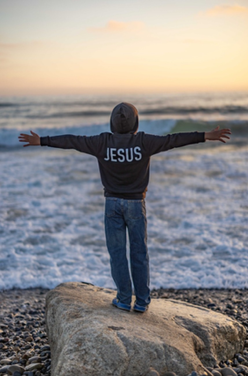 Thumbnail — Youth black “The Answer Is...” Christian hoodie detail view 3